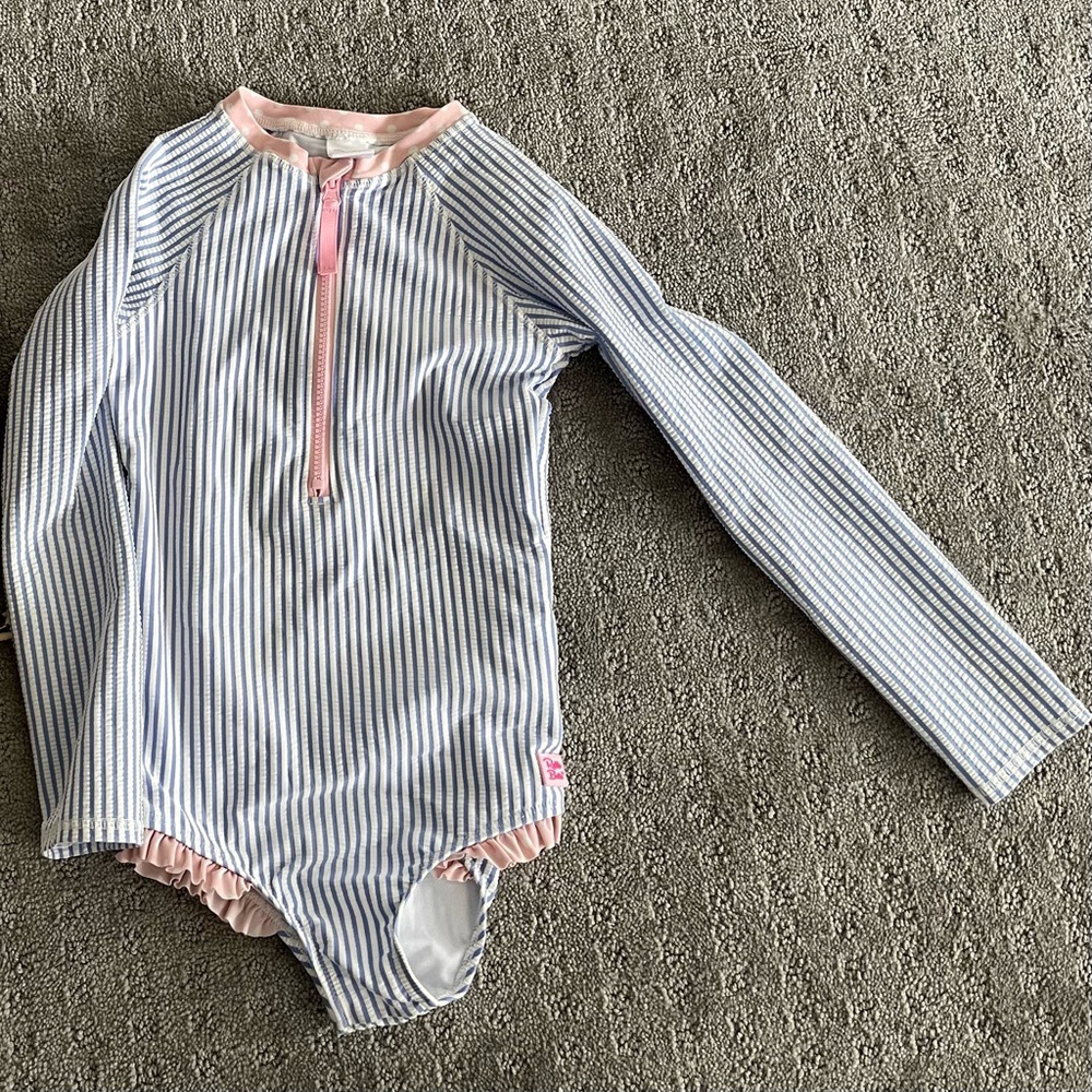 Rufflebutts brand girls swimsuit size 7. Excellent condition.